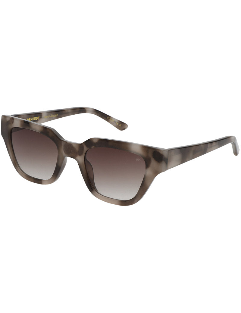 A.Kjaerbede Kaws Sunglasses Cookie Dough Angled View
