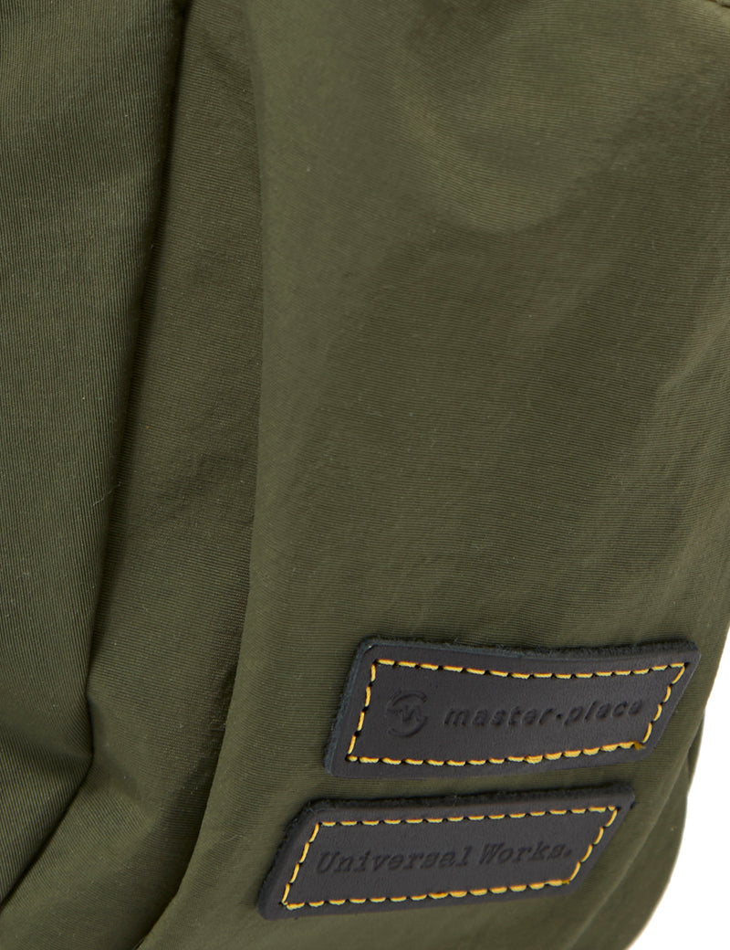 Universal Works X Master-Piece Canvas Shoulder Bag M Olive Branding Detail
